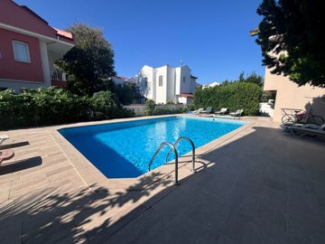 Beautifully Maintained 1-Bed Apartment For Sale In Gulpinar, Dalyan - Communal swimming pool and vast sun terraces