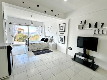 Blissful Detached Villa For Sale In Uzumlu, Fethiye - Double bedroom with an ensuite bathroom and direct access to the garden