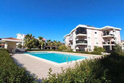 Centrally Located Apartment In Belek, Antalya For Sale - Main view of the property and communal pool