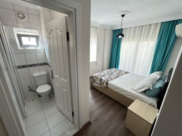 A Beautifully Renovated Apartment For Sale In Didim - Master bedroom with ensuite