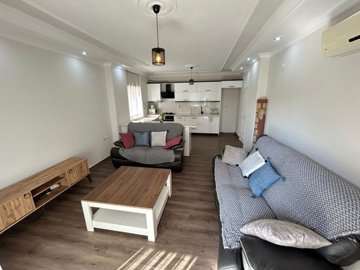 A Beautifully Renovated Apartment For Sale In Didim - Lounge to the kitchen