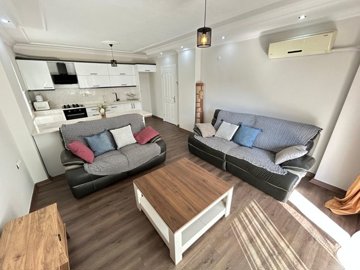 A Beautifully Renovated Apartment For Sale In Didim - Lounge and kitchen