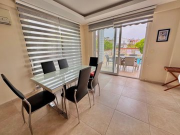 Beautiful Fethiye Property For Sale Near The Beach - Dining space with pool and garden access