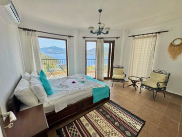 An Idyllic Detached Kalkan Villa For Sale - Double bedroom with sea views and balcony
