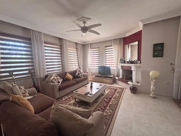 Tranquil Dalyan Villa For Sale In Ortaca - Lounge with stone fireplace