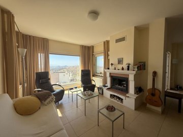 Sea View Triplex Bodrum Villa For Sale In Koyunbaba, Gumusluk - Lounge with fireplace and sea views