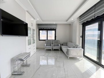 Sea View Alanya Penthouse For Sale With A Shared Pool - Open-plan living room
