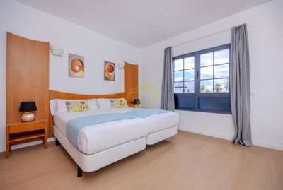 Front line bungalow with communal pool at Coral Beach in Playa Blanca